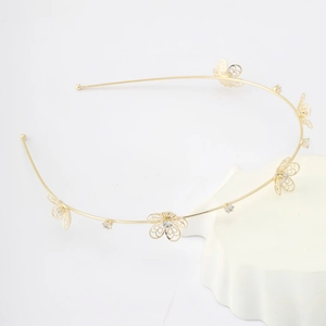 Elegant gold metal headband featuring hollow butterfly designs with sparkling zircons