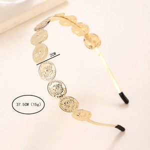 Detail view of golden coin headband showing 2cm diameter coin and 37.5cm length measurements
