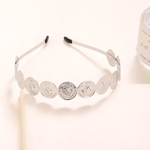 Silver metal headband with vintage embossed round coins and black comfort end tips