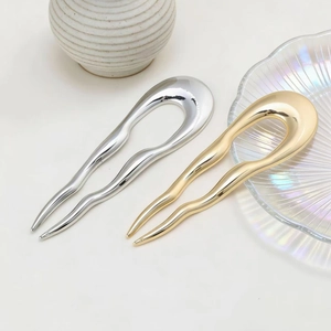 Minimalist U-shaped hair pins in gold and silver finish with elegant wavy design