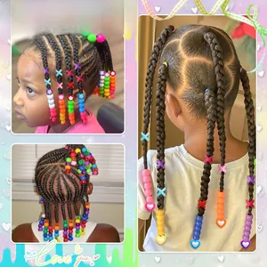 Close-up of colorful acrylic beads and hair clips applied on braided hairstyles for kids