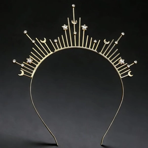 Close-up of golden celestial headband featuring radiant star and moon crystal details