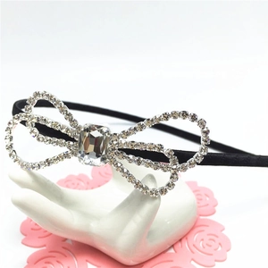 Elegant black headband with sparkling rhinestone bowknot featuring a central crystal stone