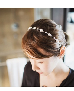 Detail of silver headband with alternating white pearls and crystal rhinestones