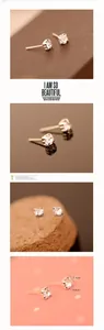 Detailed views of shiny square stud earrings with sparkling cubic zirconia in 4-claw settings