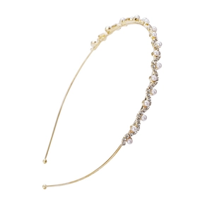 Elegant gold metal headband featuring wavy patterns of faux pearls and sparkling rhinestones