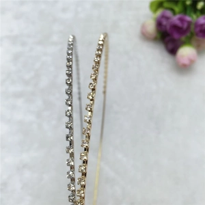 Detailed close-up of double-row rhinestone headbands in silver and gold plating