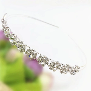 Macro detail of elegant silver headband featuring sparkling sunflower rhinestone pattern