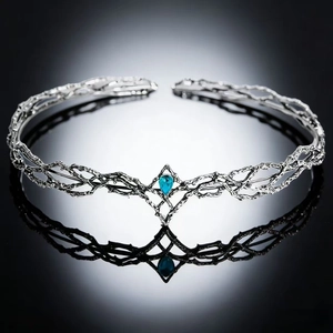 Silver elf crown with vintage branch texture and teardrop blue crystal centerpiece