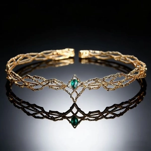 Elven queen tiara in golden branch design with a teardrop green gemstone centerpiece