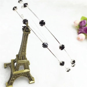 Detailed close-up of double-layered silver alloy headband with faceted black crystals