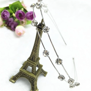 Detail of silver alloy headband with prong-set sparkling rhinestones and crystals