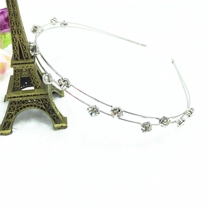 Close-up of double-layered silver headband featuring sparkling crystal rhinestones