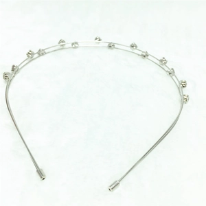 Detail of a dual-layered silver headband with sparkling crystal rhinestones on a white background