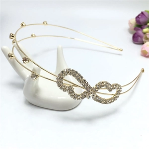 Close-up of double-layer bridal headband with sparkling rhinestones and heart motif