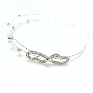 Detail of double-layer silver bridal headband with sparkling rhinestone bow