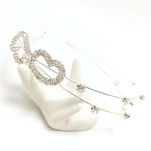 Elegant bridal silver headband with sparkling rhinestone double heart design for weddings