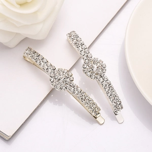 Elegant silver rhinestone floral hair clips set on a clean white aesthetic background