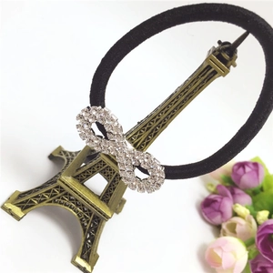 Detail of black elastic hair tie with sparkling rhinestone infinity symbol decoration