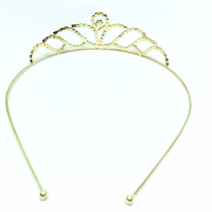 Detail view of the intricate wave pattern and crystals on the gold bridal tiara