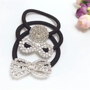 Three-piece set of black elastic hair ties with sparkling rhinestone bow and circle charms