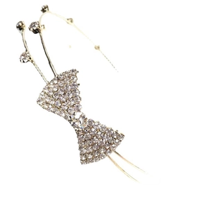 Serre-tête nœud en strass avec monture en métal doré pour une coiffure de mariée élégante
