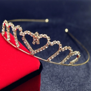 Elegant gold heart-shaped crown headband with sparkling rhinestones for bridal or party use