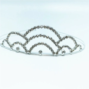 Detail view of silver bridal tiara with layered rhinestone arches for weddings