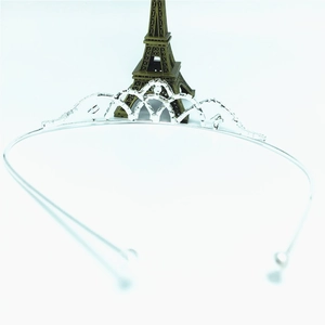Detail of silver bridal crown headband with shimmering rhinestones on white background