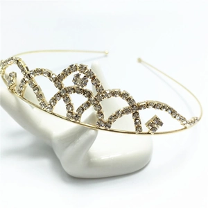 Detail of a golden bridal crown hairband with shimmering rhinestones on a display