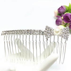 Elegant silver hair comb with crystal rhinestones, bow design, and a large white pearl detail