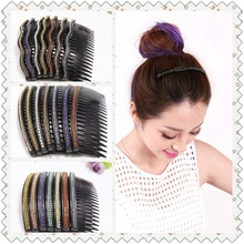Close-up of hair comb with colorful rhinestones on a resin base for bun hairstyles