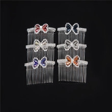 Detail of six colorful butterfly hair combs featuring rhinestones and metal tines