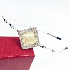 Silver twisted headband featuring a central pearl and rhinestones with a gift box