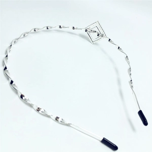 Silver twisted metal headband with a geometric square motif for elegant hair styling
