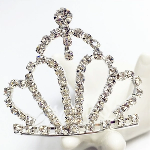 Detailed macro view of a silver crown hair comb with shiny clear rhinestones
