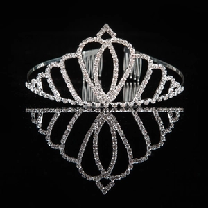 Detailed view of silver crystal tiara with heart pattern and side combs on black background