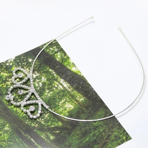 Detail of silver heart crown headband with sparkling rhinestones for bridal hairstyle