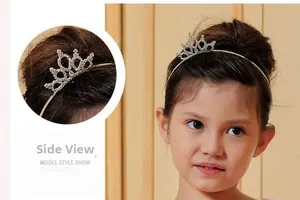 Detailed side view of silver crown headband with white crystals for children