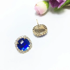 Elegant halo stud earrings featuring dark blue round crystal with white zircon border