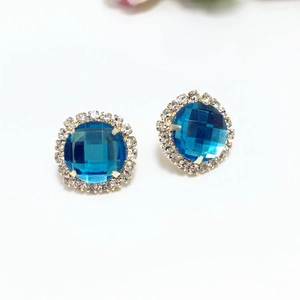 Elegant gold flower halo earrings with royal blue round checkerboard cut crystal centers