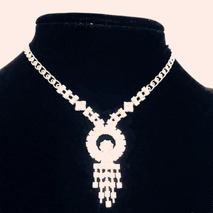 Sparkling crystal rhinestone necklace with round pendant and five fringe tassels for gala