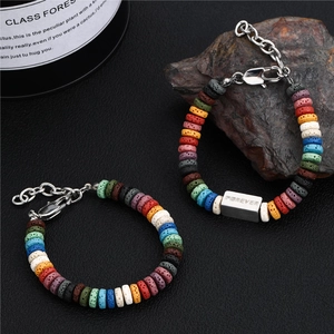 Close-up of rainbow volcanic stone beads with a FOREVER engraved titanium steel charm