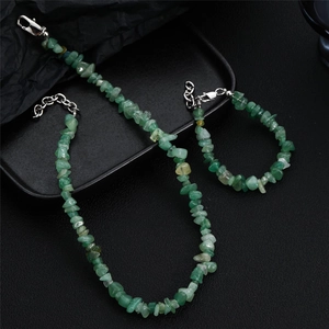 Detail of natural green aventurine chip necklace and bracelet set with silver clasp