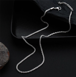 Detail view of sparkly titanium steel chain with lobster clasp and adjustable links