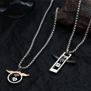Detail view of titanium steel necklaces with heart wings pendants and box chains