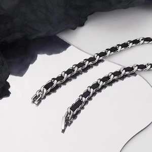 Titanium steel cuban chain with black leather weaving and a silver metallic folding clasp