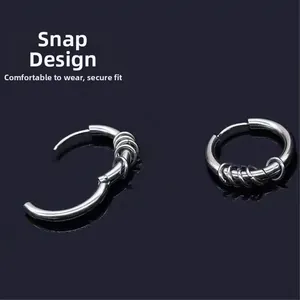 Detail view of silver titanium steel hoop earrings featuring a secure snap closure design