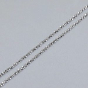 Close-up of polished silver cable chain in stainless steel with detailed metal links