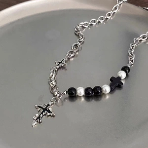 Gothic silver chain necklace with black beads and dual cross pendants detail